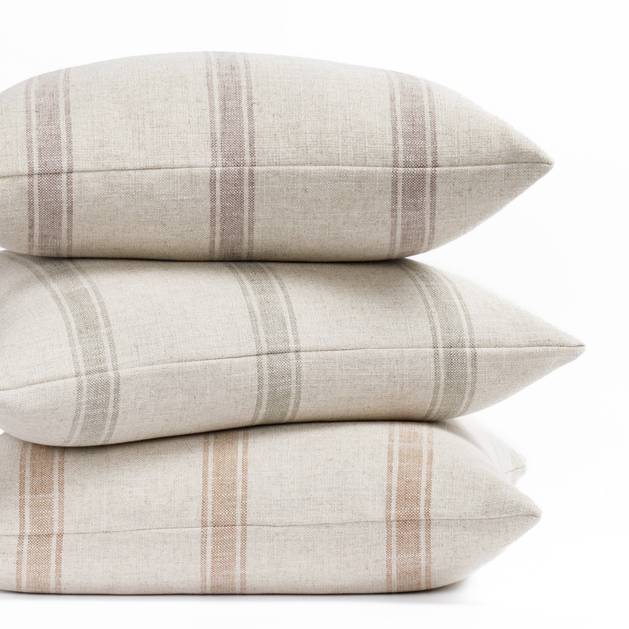 theo stripe pillows in mauve, rust and lake colorways