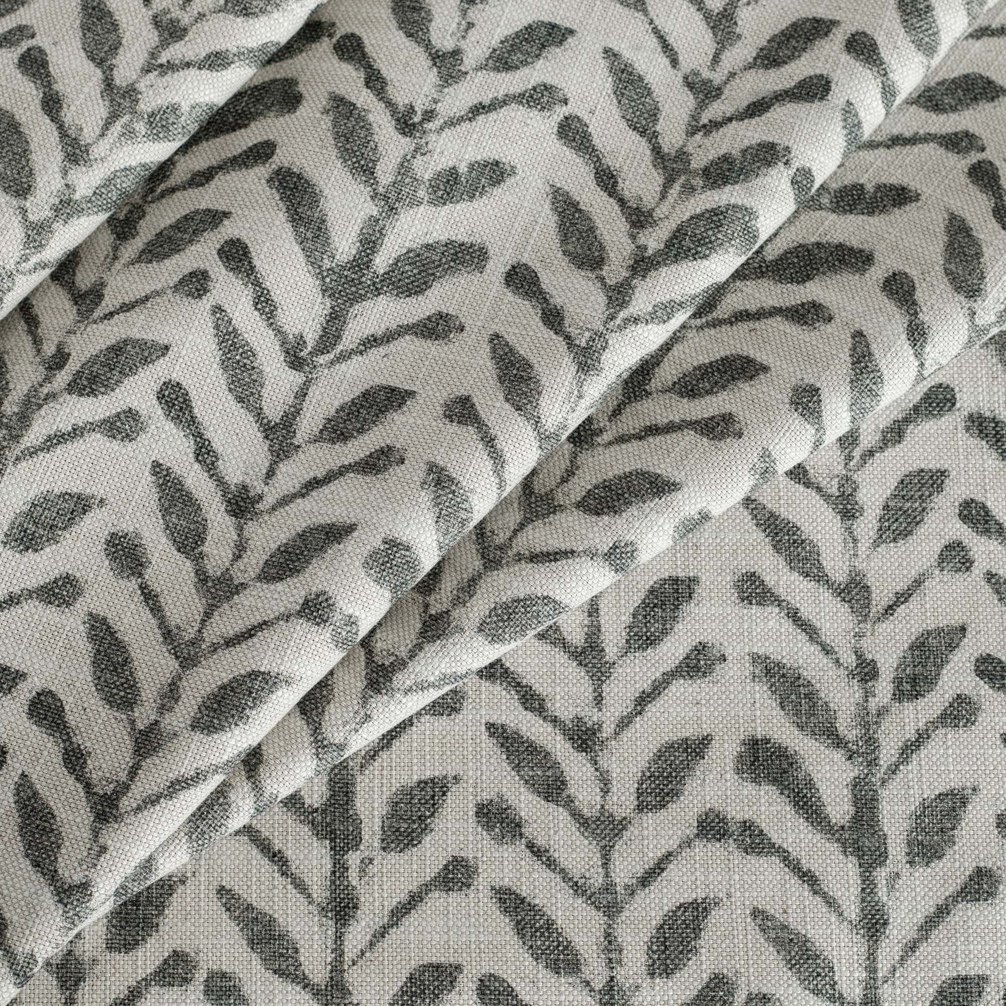 a modern inky charcoal grey and cream botanical print home decor fabric from Tonic Living