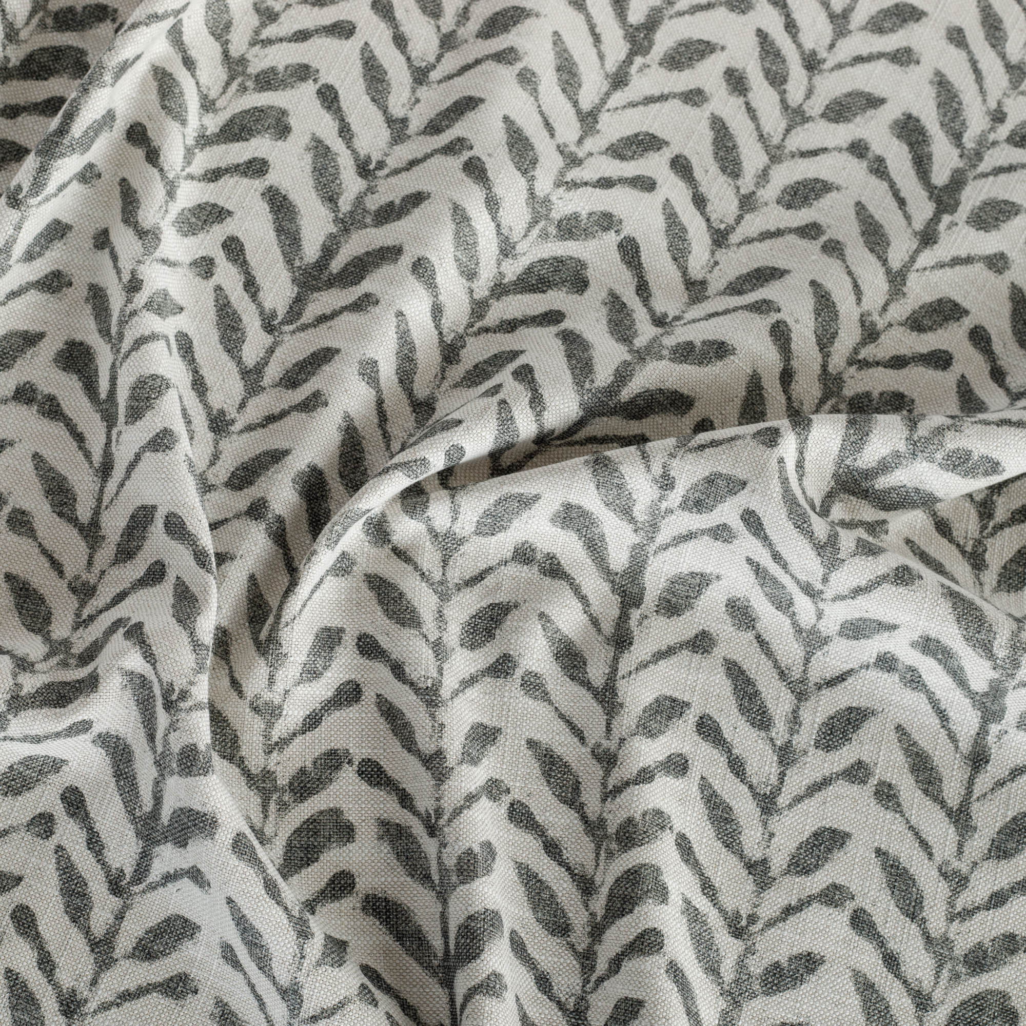 Togo Black & Natural fabric, a charcoal gray and oatmeal beige botanical print fabric from Tonic Living