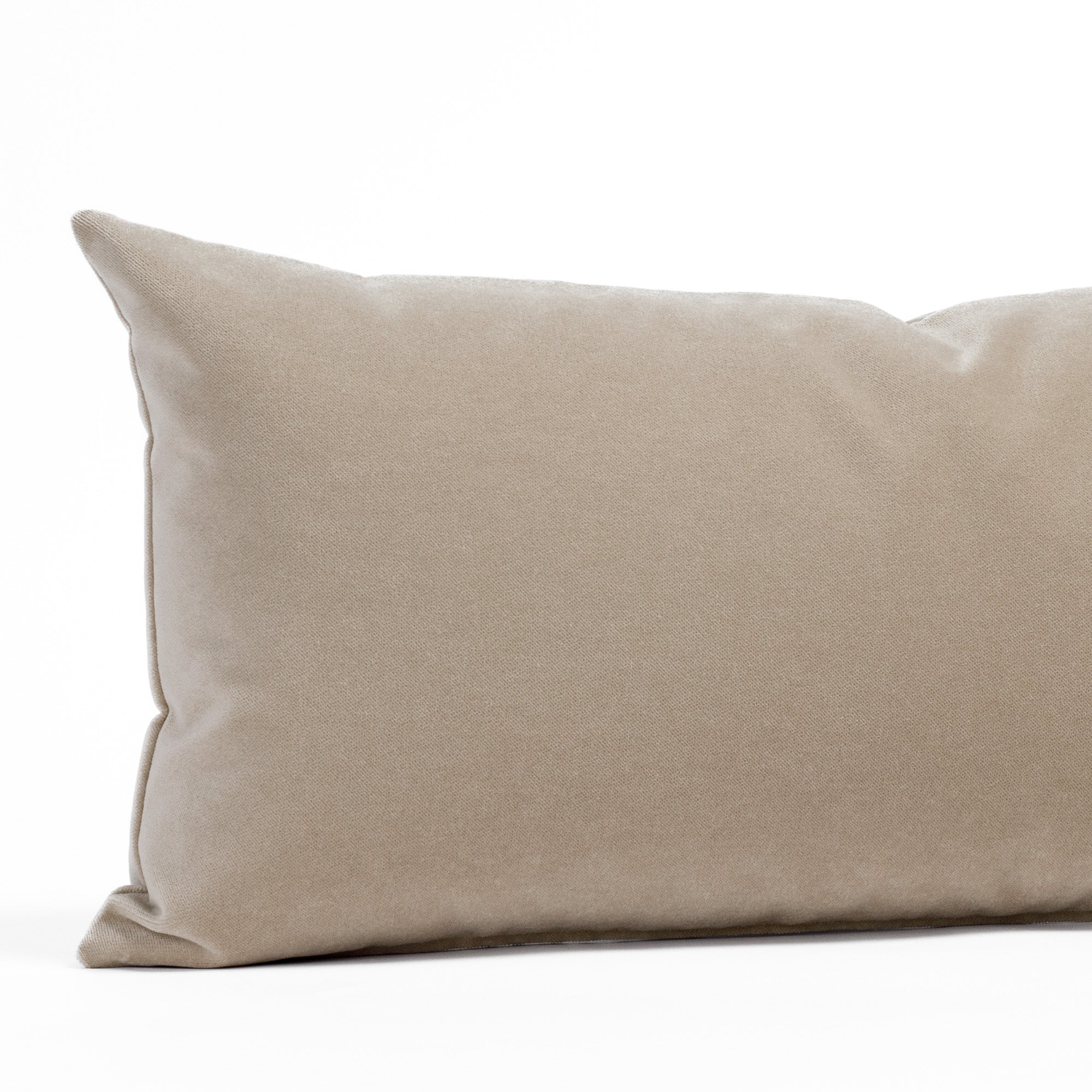 Valentina Velvet Cashmere 12x24 Lumbar Pillow from Tonic Living, a taupe velvet pillow with a subtle glow: close-up view.