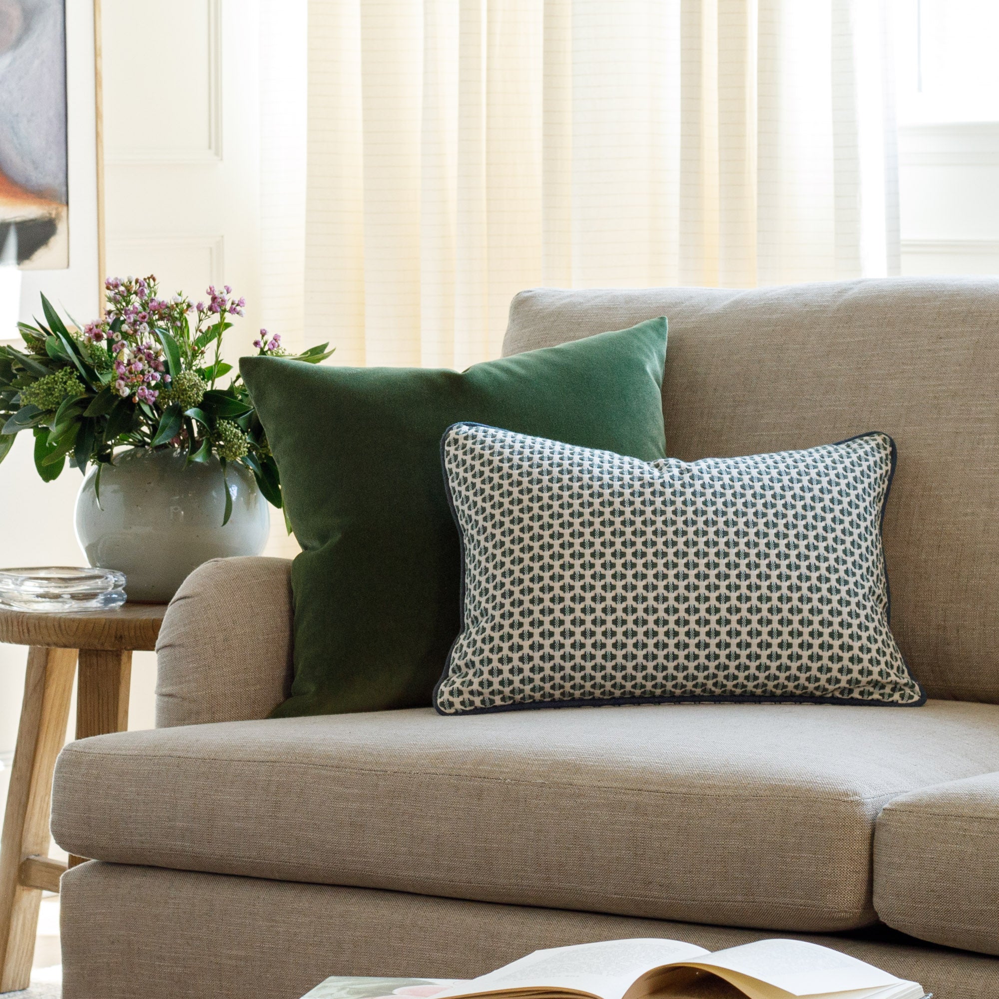 Designer toss pillows from Tonic Living, styled on a couch.