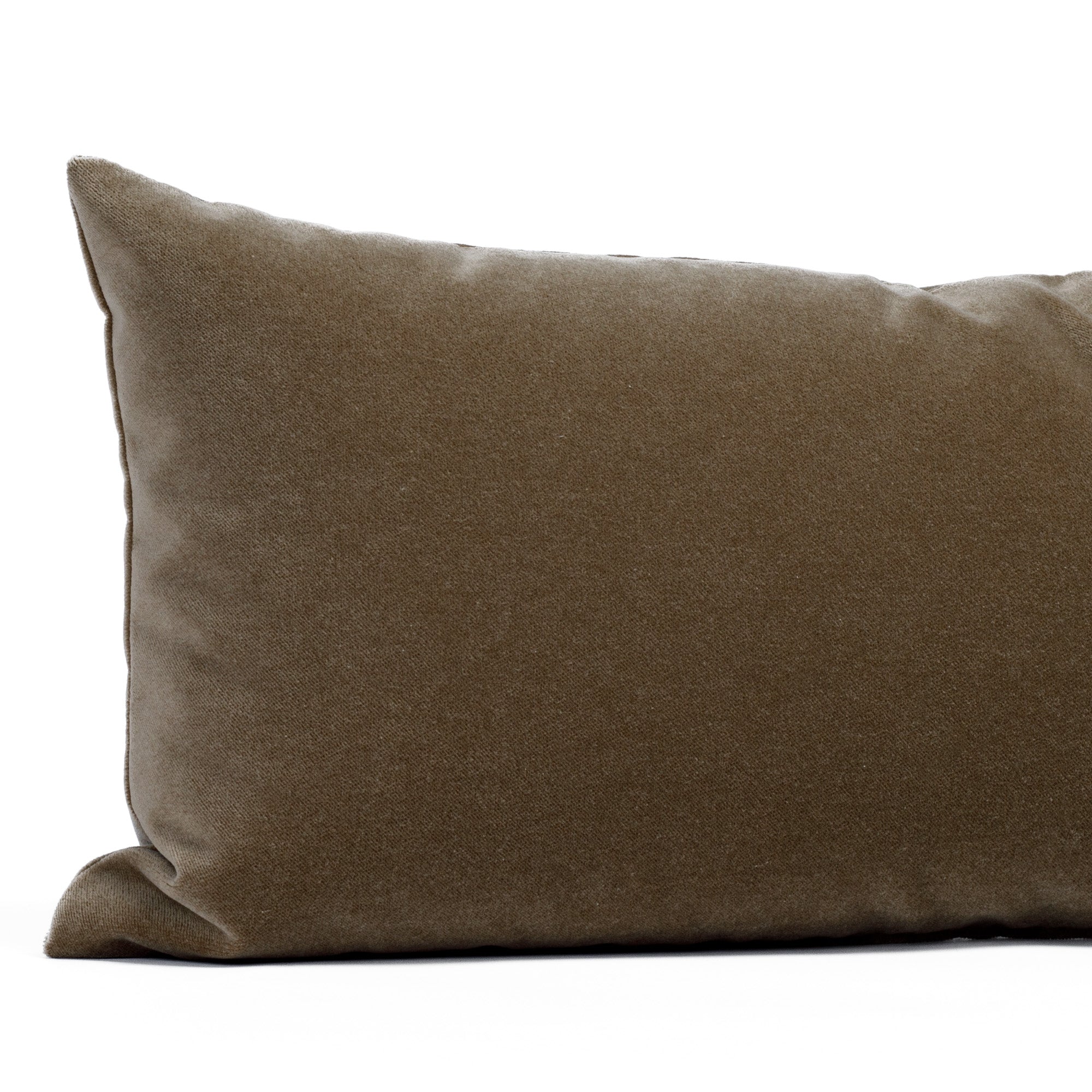 Valentina Velvet Toffee 12x24 Lumbar Pillow from Tonic Living, a hazelnut brown velvet pillow with a subtle glow: close-up view.