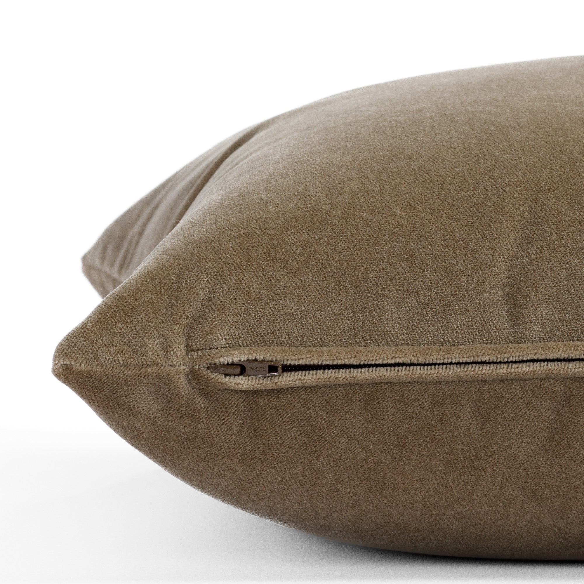 an earthy brown pillow : close up zipper detail