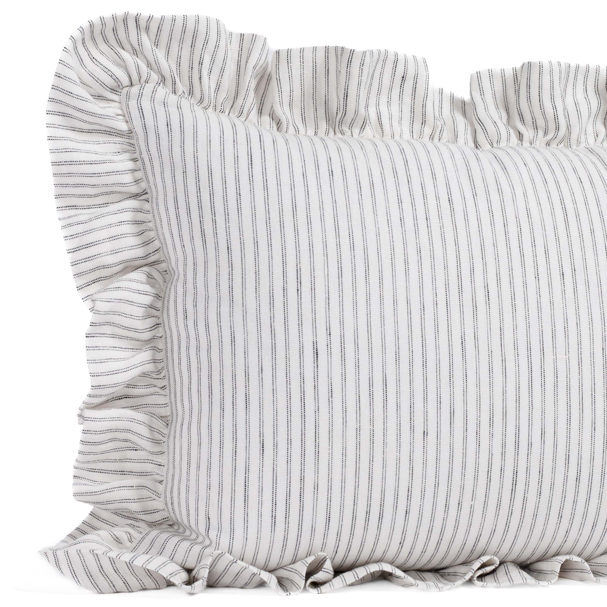 Side close-up of the Verona 14x20 ruffle pillow by Tonic Living, showing the layered ruffle edge and pinstripe detail in creamy white and jet black.