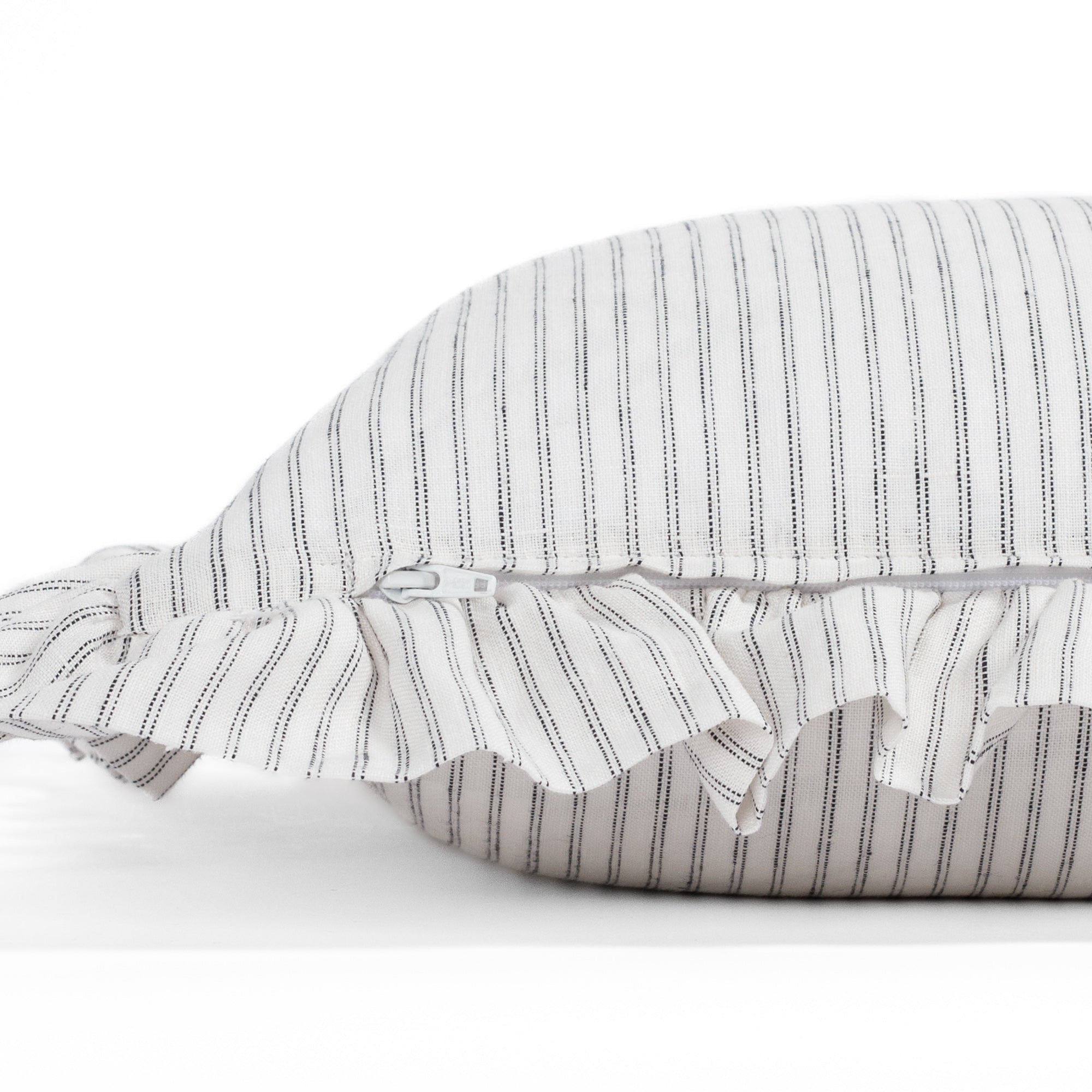 Side detail of the Verona 14x20 ruffle pillow with concealed zipper, highlighting the clean finishing and high-quality construction of this black and white striped lumbar pillow by Tonic Living.