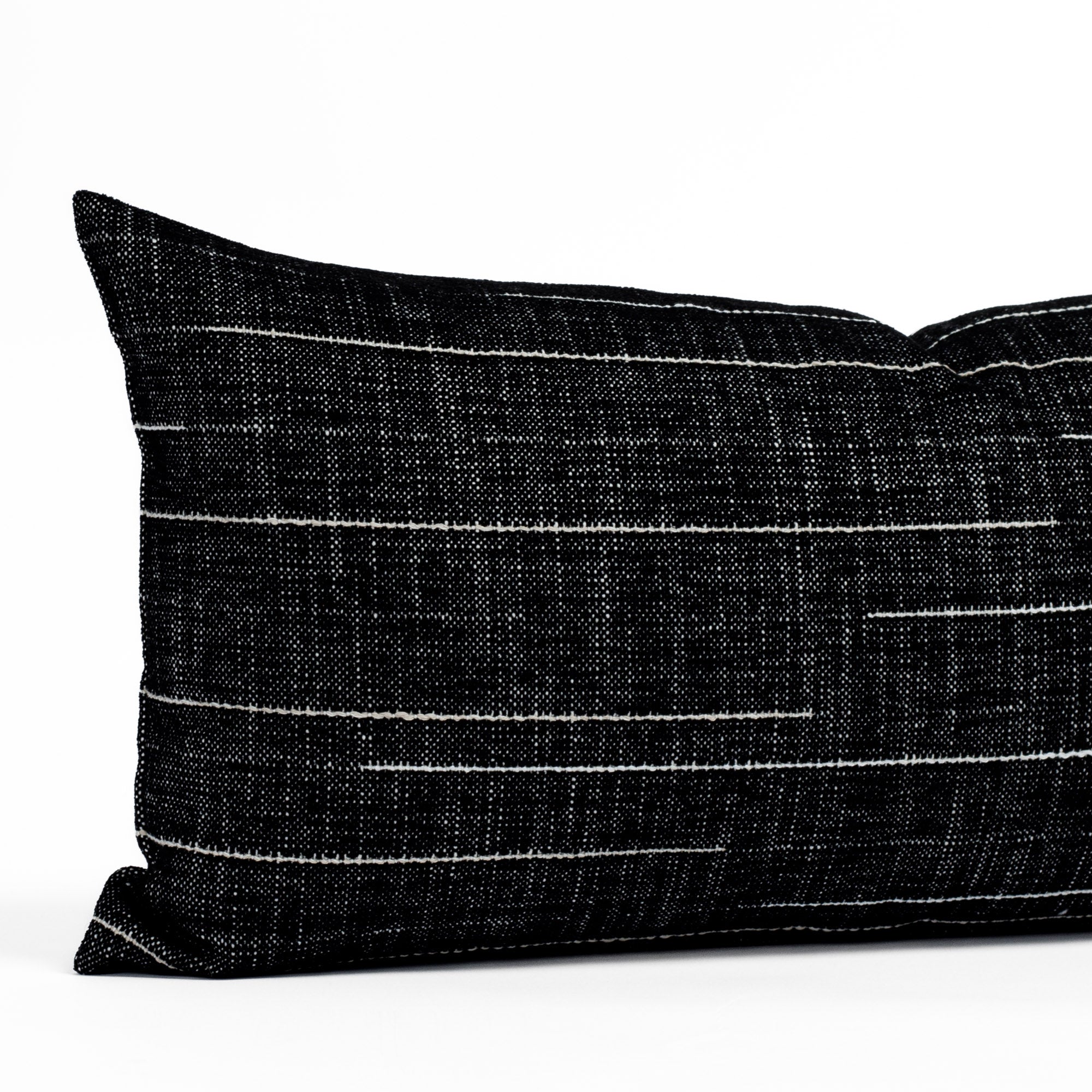 Yuzu Onyx 12x24, a black and white indoor/outdoor pillow from Tonic Living: close-up view.