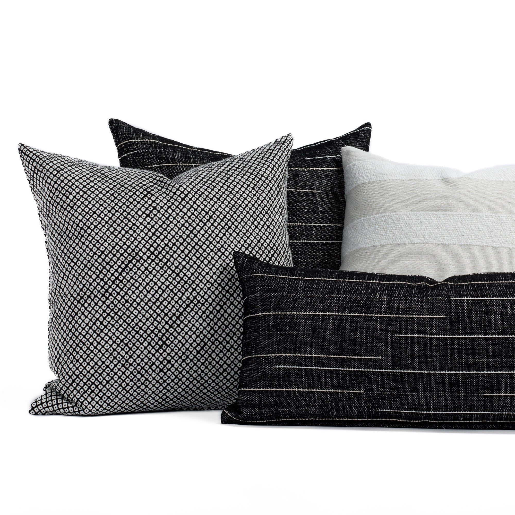A selection of black and white patterned indoor/outdoor pillows from Tonic Living.