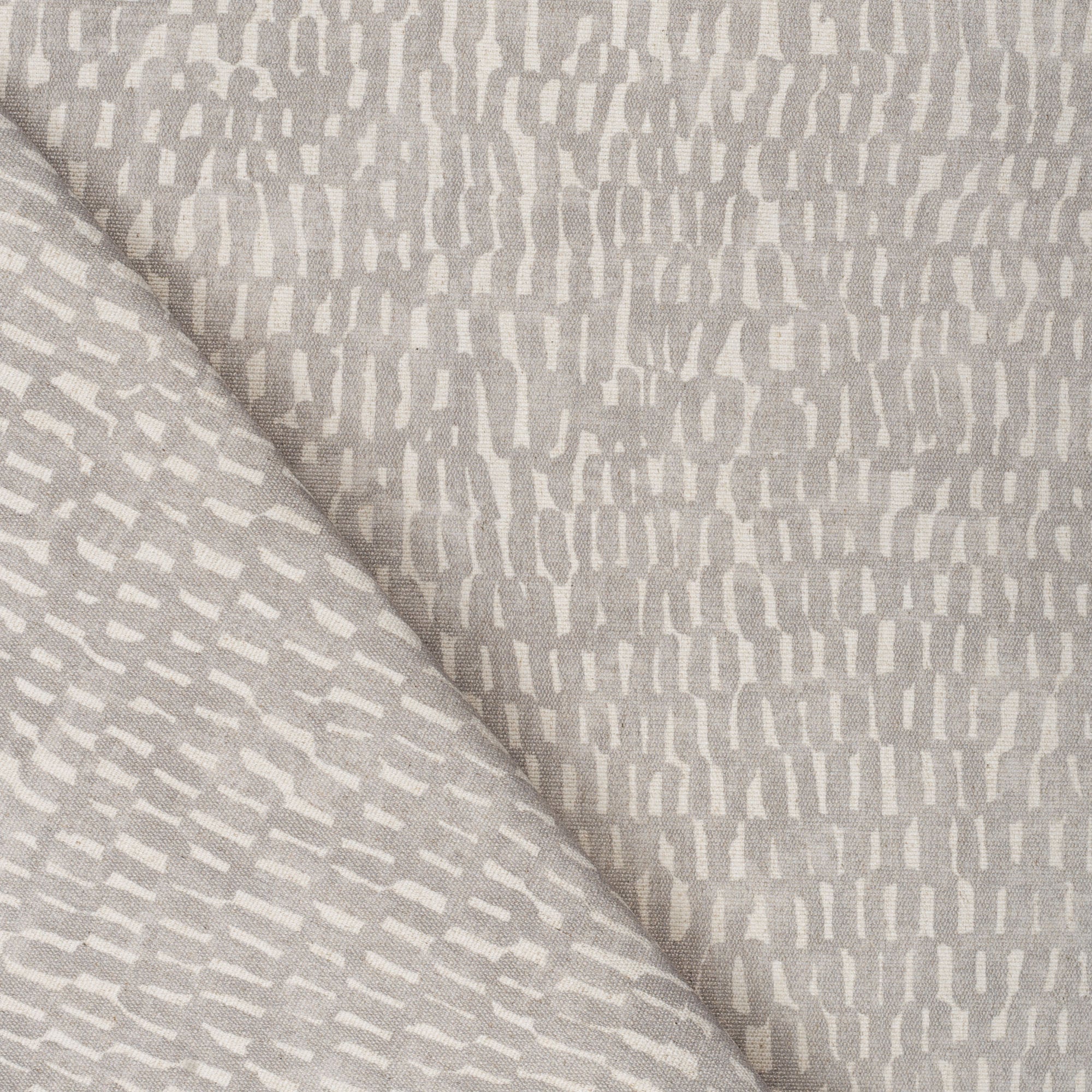 Avareno Silver, a light gray and sandy beige small scale abstract print fabric from Tonic Living 