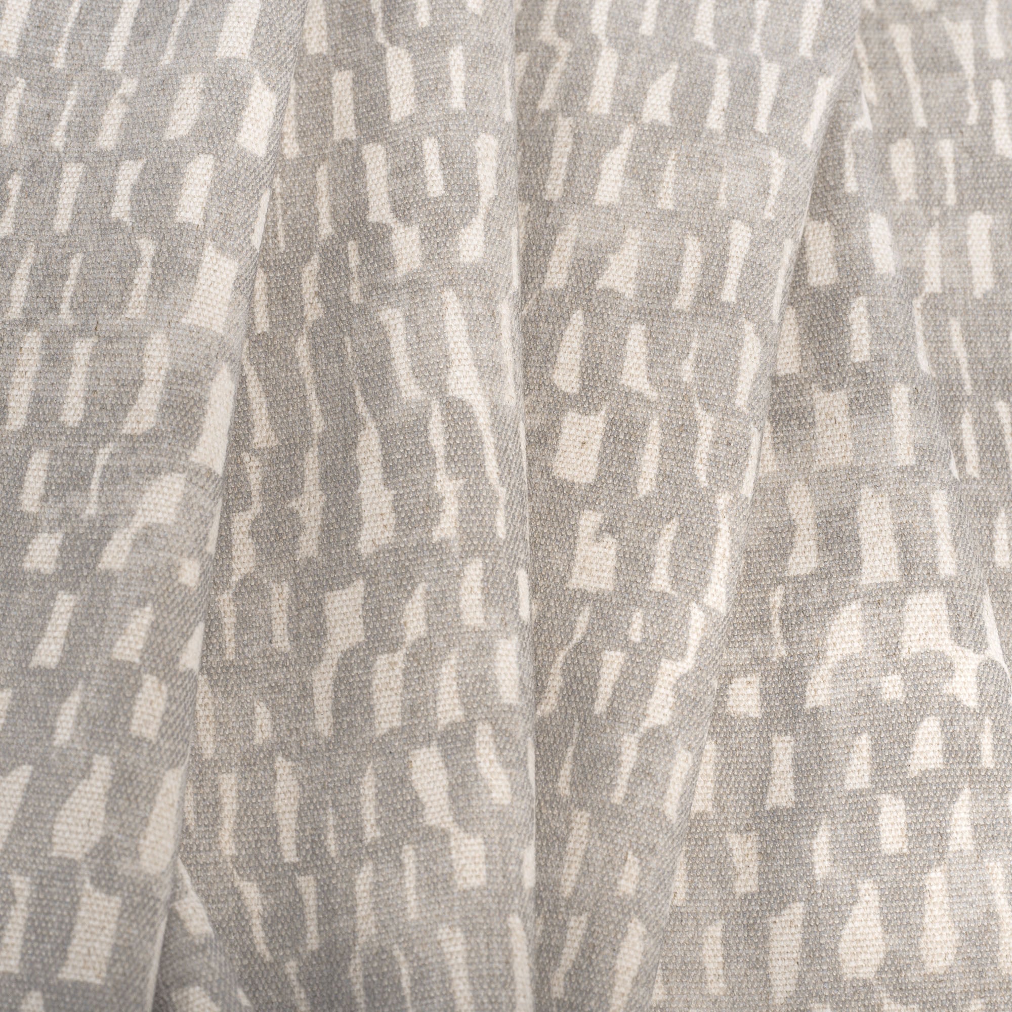 Avareno Silver, a light gray and sandy beige small scale abstract print fabric : close up
