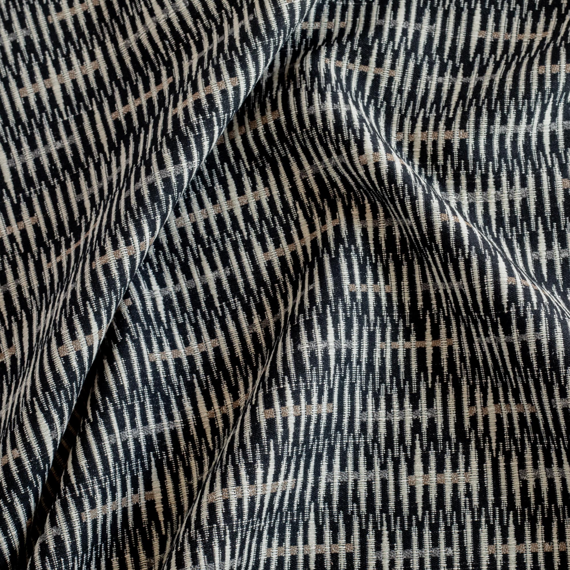 a graphic global pattern black, brown and tan home decor fabric