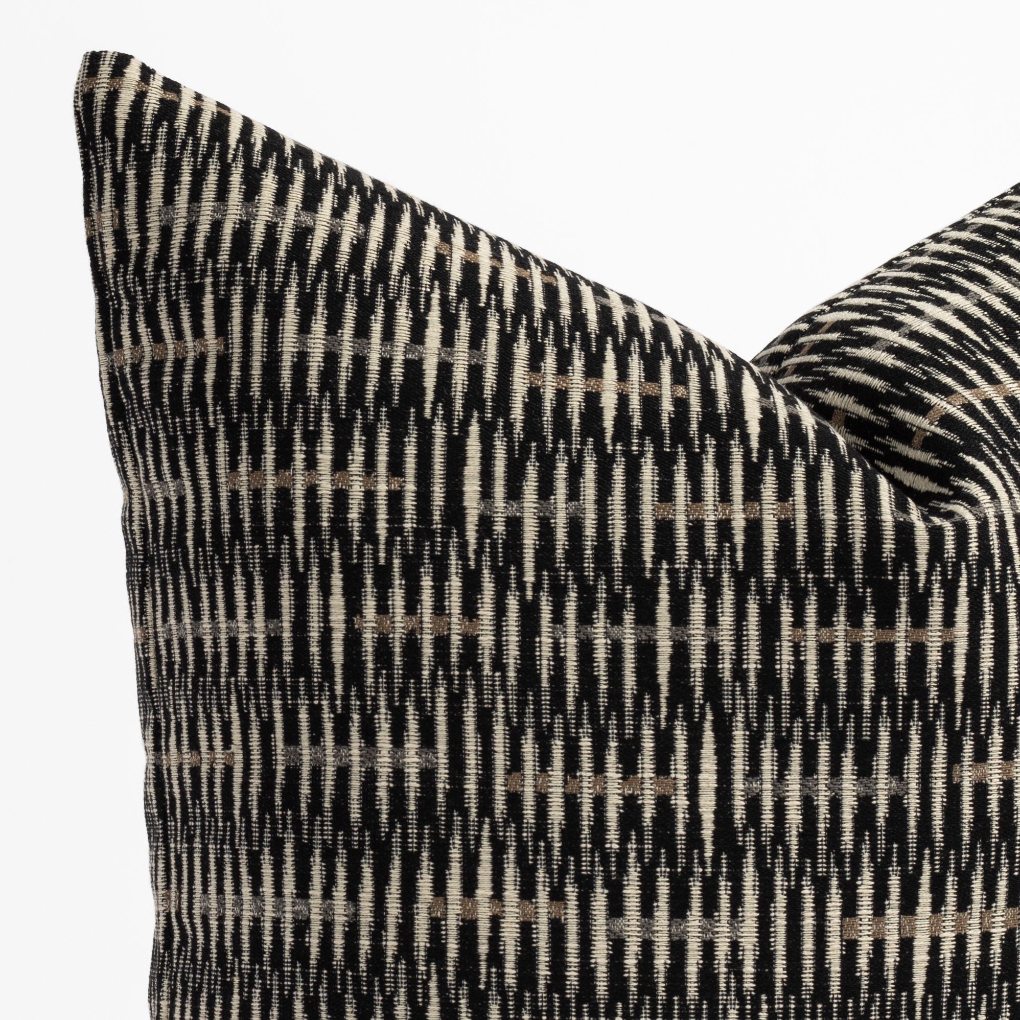 a black, brown and tan modern abstract patterned throw pillow