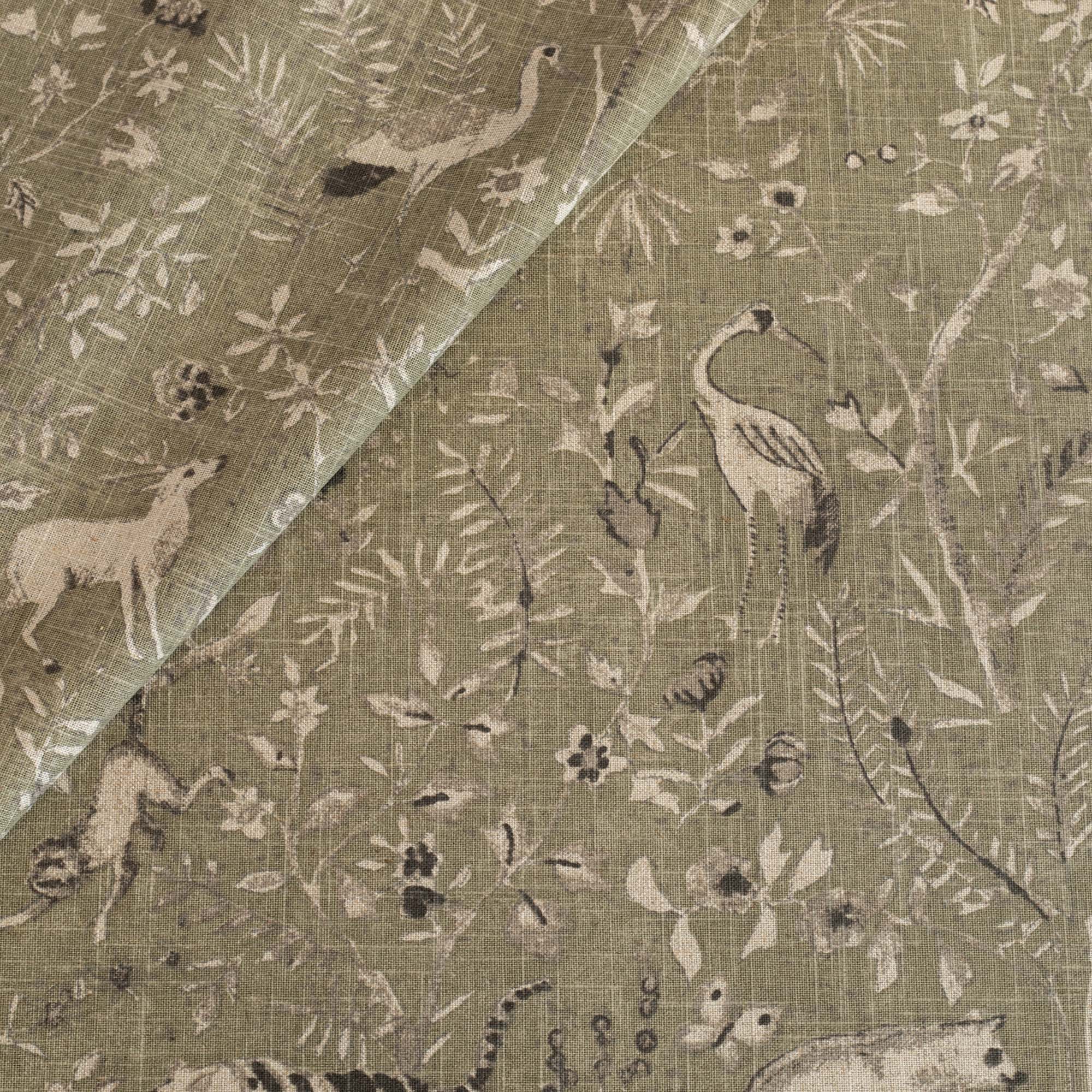 a green botanical and exotic animal patterned linen blend fabric 