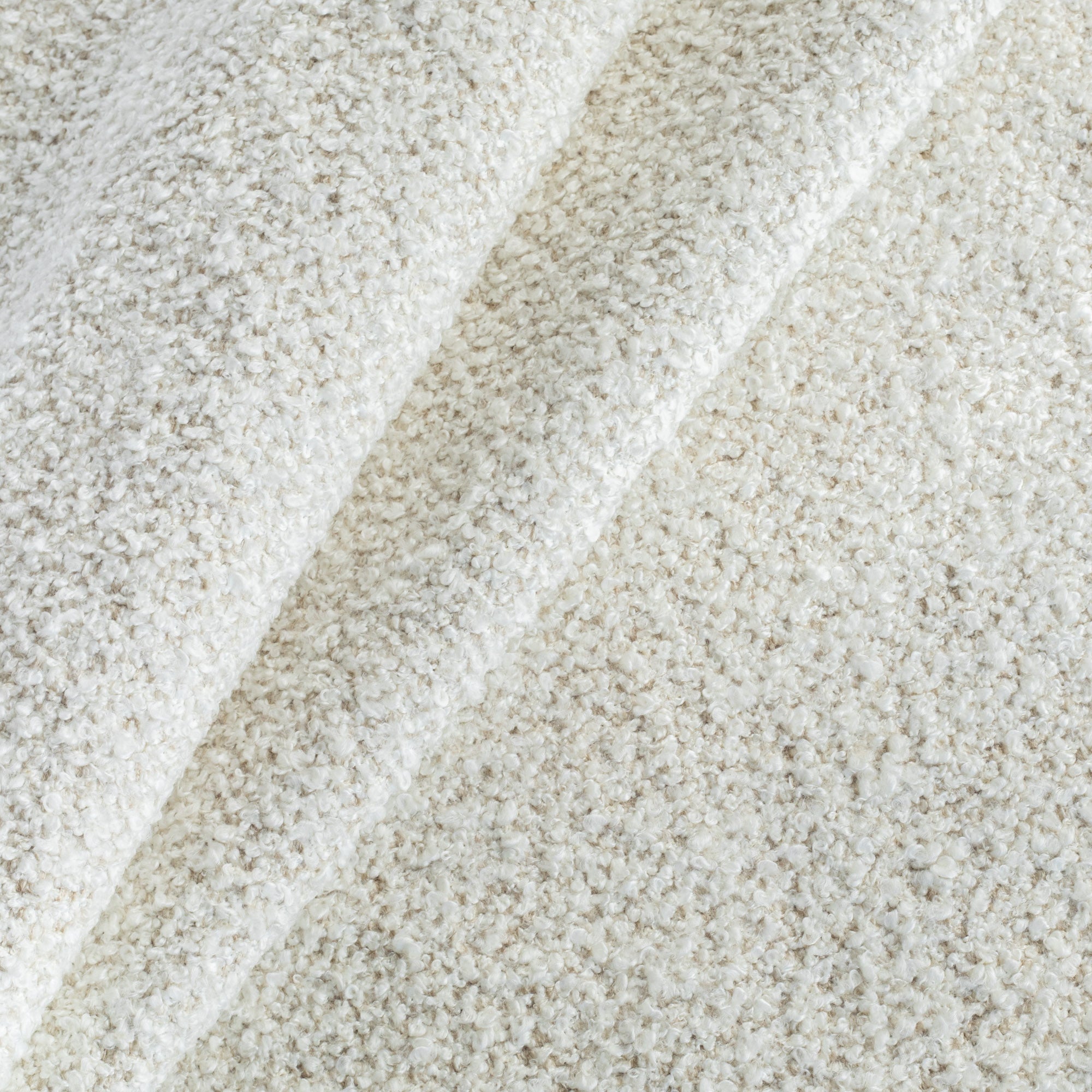 a cozy cream boucle upholstery fabric