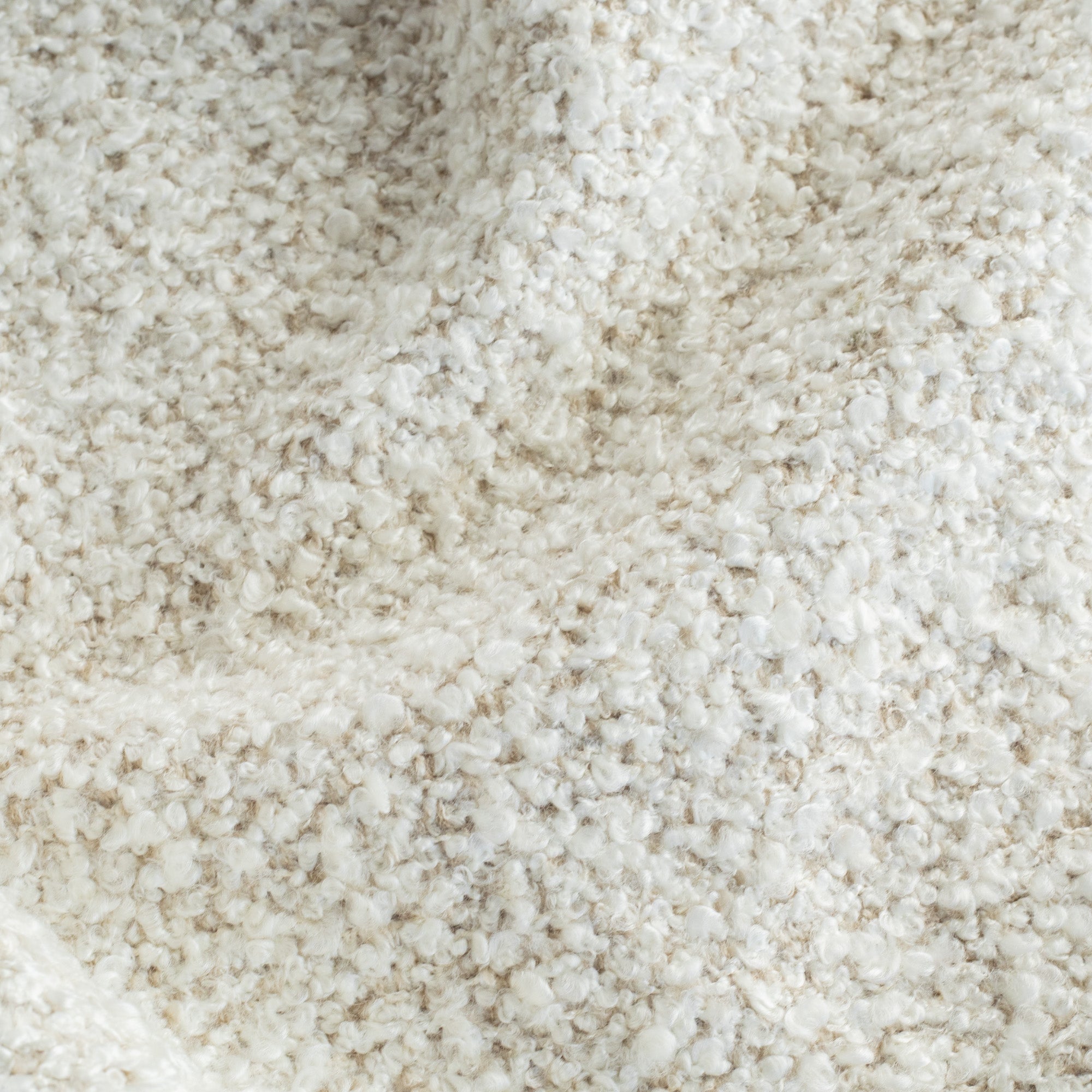 a cream boucle textured upholstery fabric