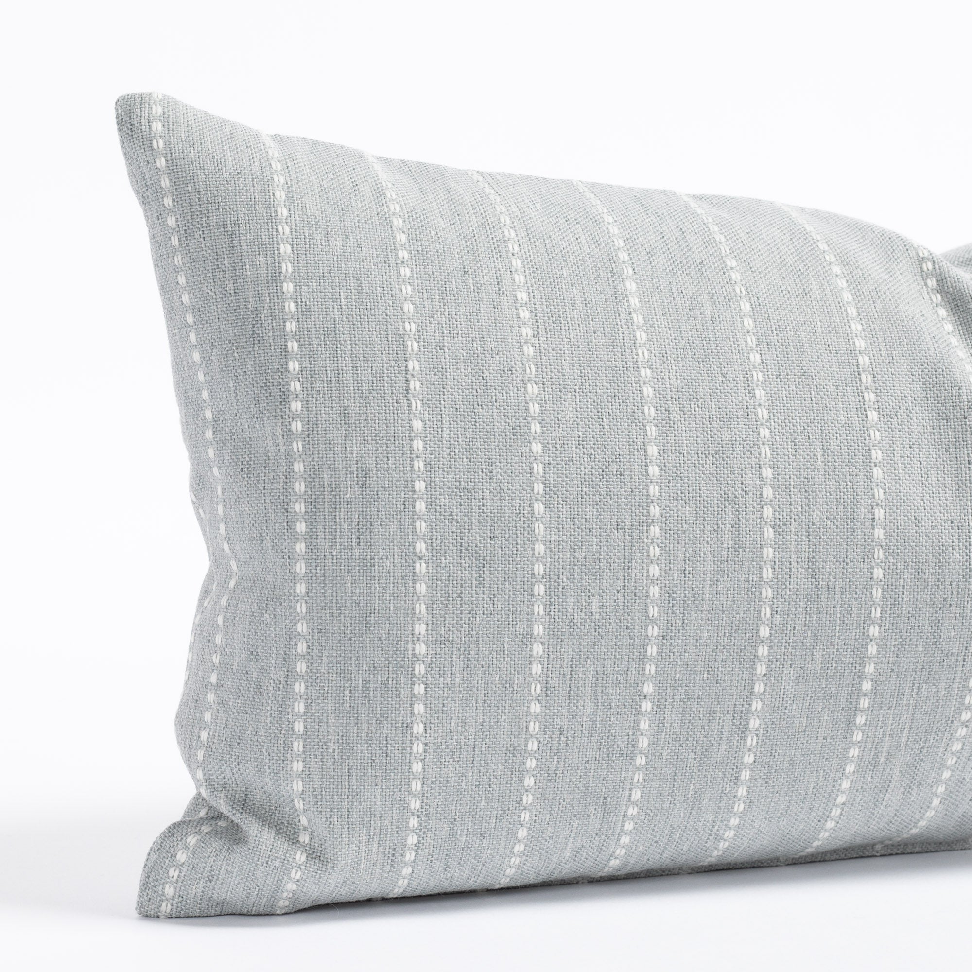 a blue gray with white stripe indoor outdoor lumbar pillow