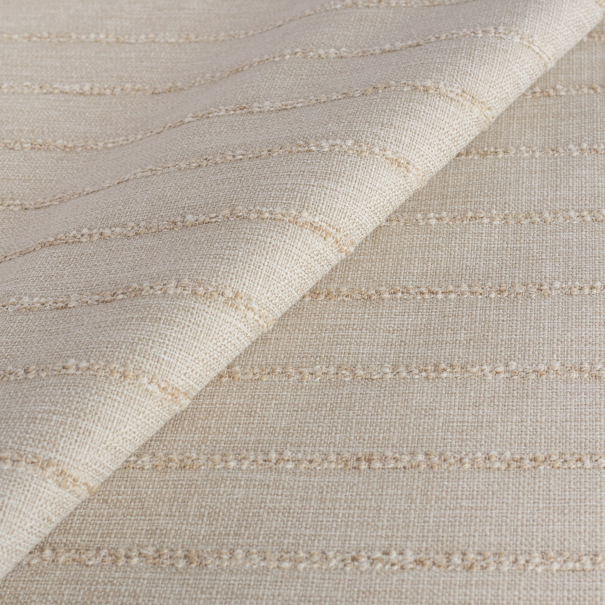 a cream color tonal horizontal textured stripe performance upholstery fabric