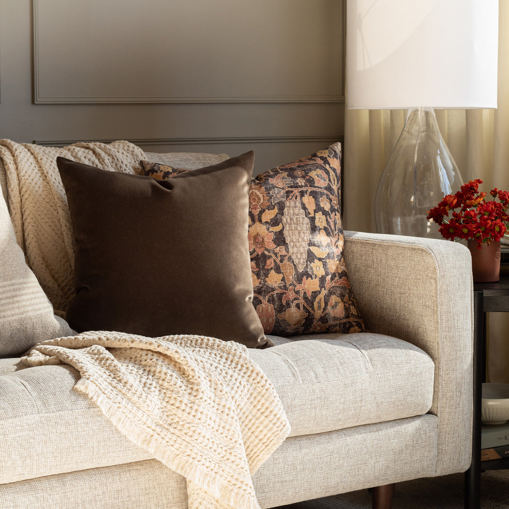 Kalida, a faded black and earth toned vintage floral tapestry print decorative pillow