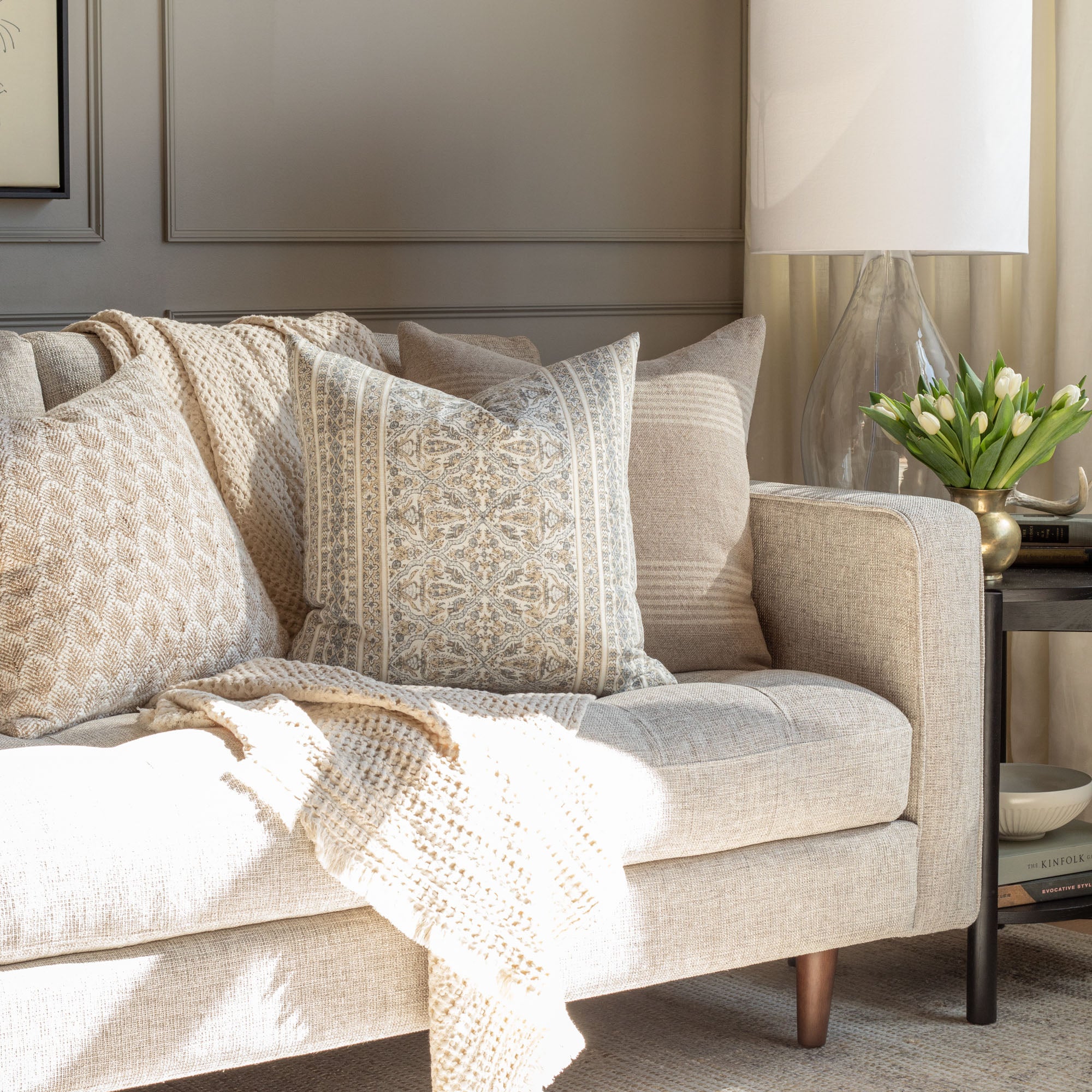 intricate mix of tan and light blue-grey motifs paired with natural earthy textures - living room scene by Tonic Living