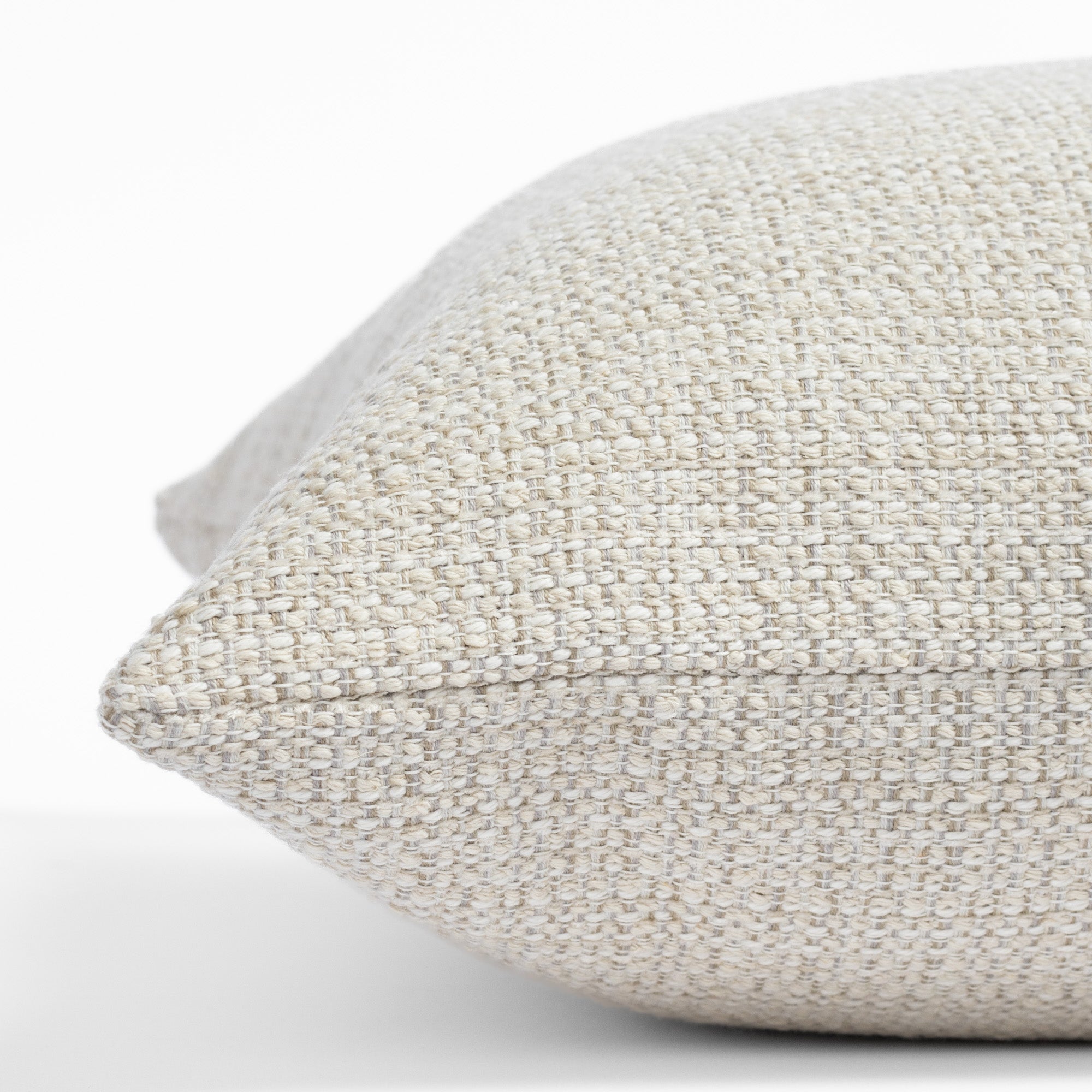 Milly 22x22 Vanilla Cream pillow, a sandy cream nubby textured pillow : close up side view