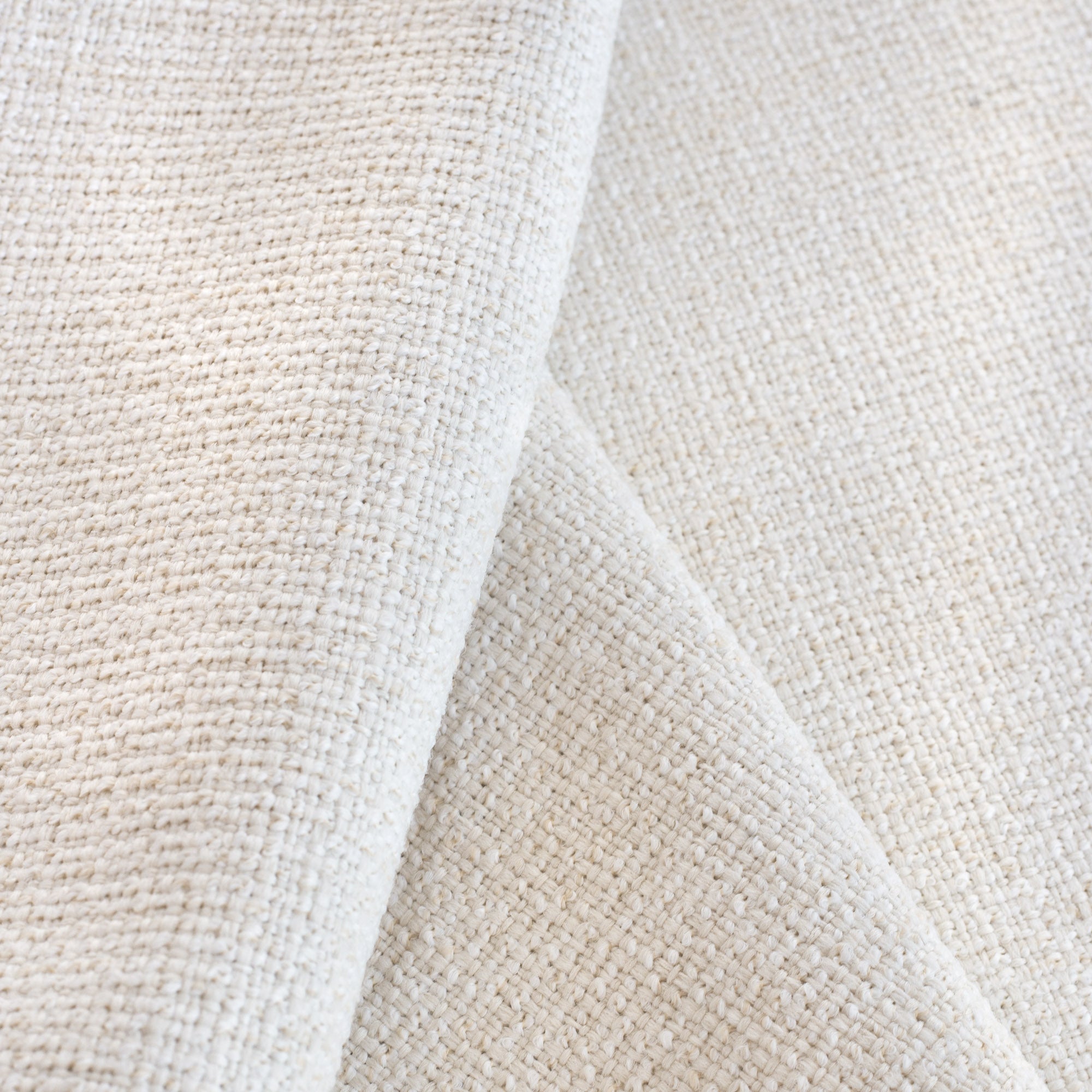 Preston Oyster, a light cream basket weave performance fabric