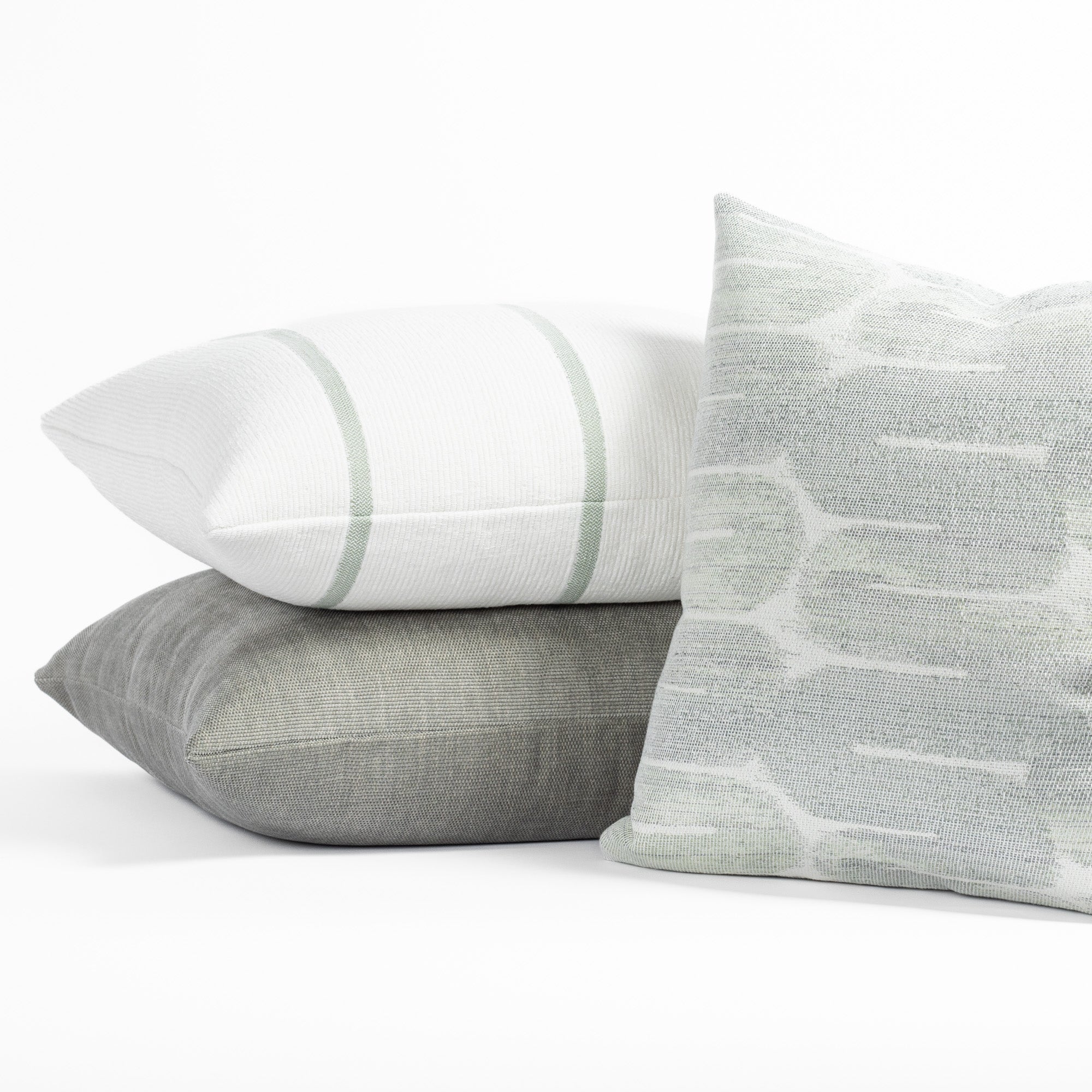 Designer Tonic Living throw pillows in soft green, white and gray colours