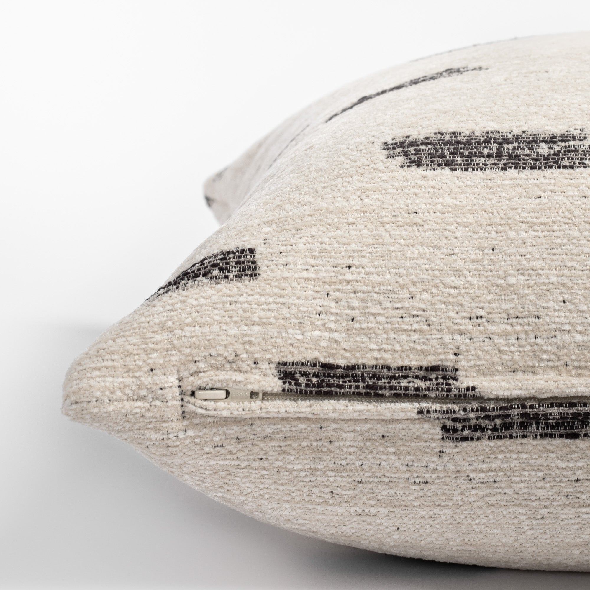 Stratus 20x20 Pillow Cream, a graphic cream and black pattern pillow : close up of zipper side