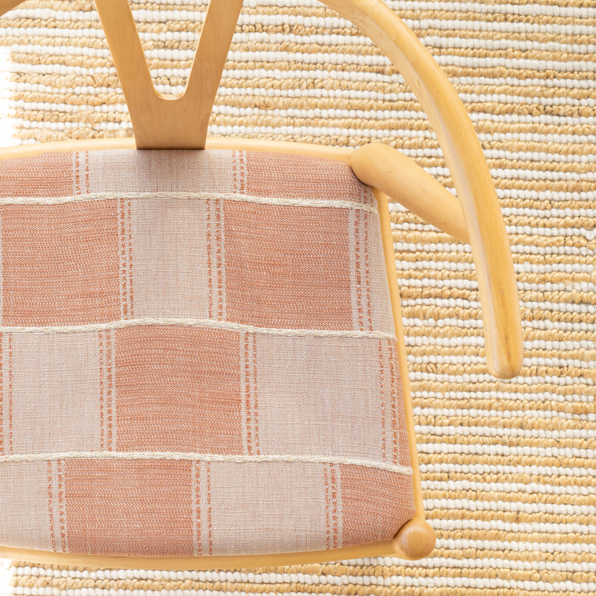 a beige and terracotta patchwork pattern with a chunky burlap stitched horizontal stripe upholstered dining chair seat