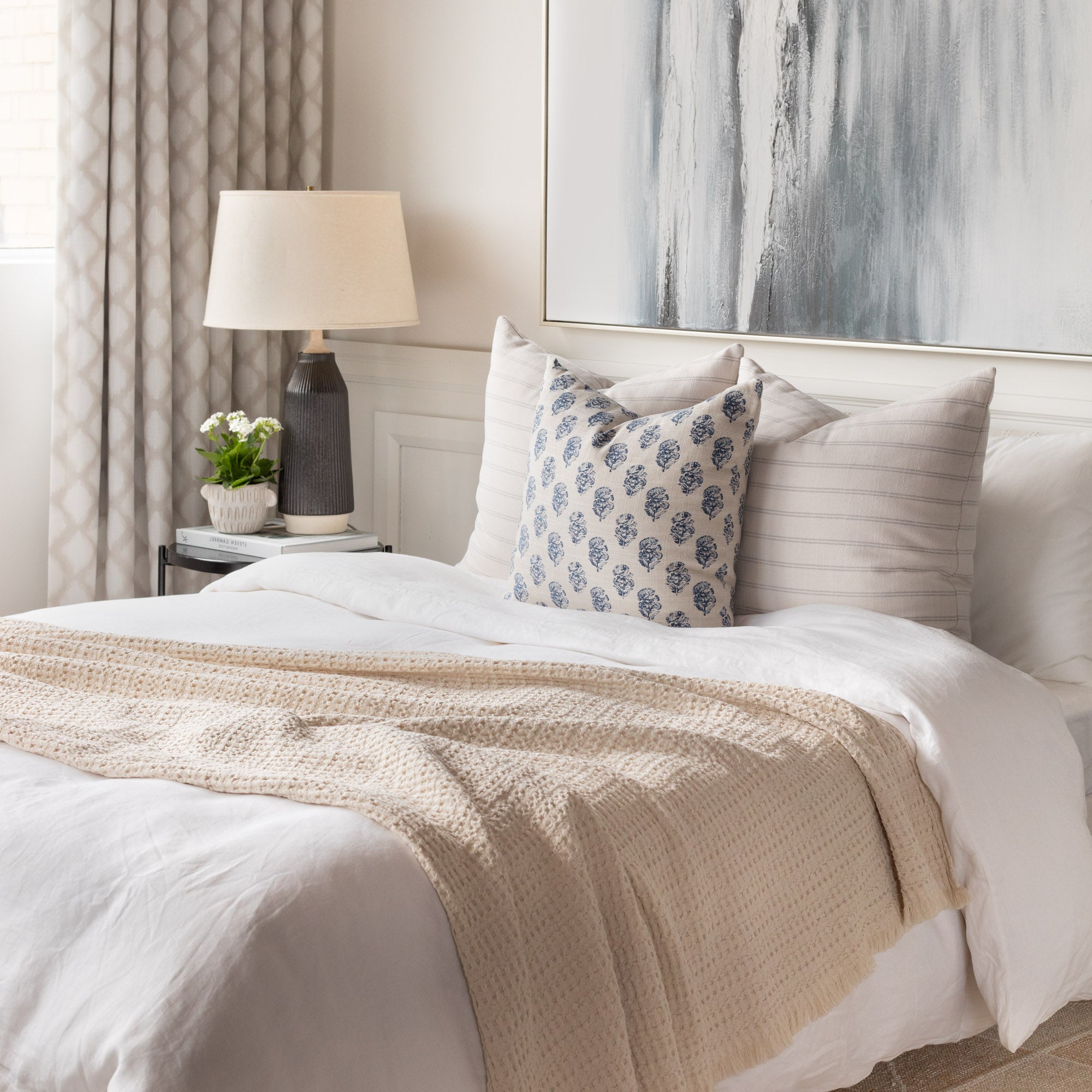 Bedroom Vignette : Zola pillow in front of two Handlavet pilows on bed with Lena natural blanket