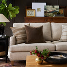 Living room with Acadia Stripe cinnamon brown and Valentina Velvet dark brown pillows styled on a sofa – Tonic Living
