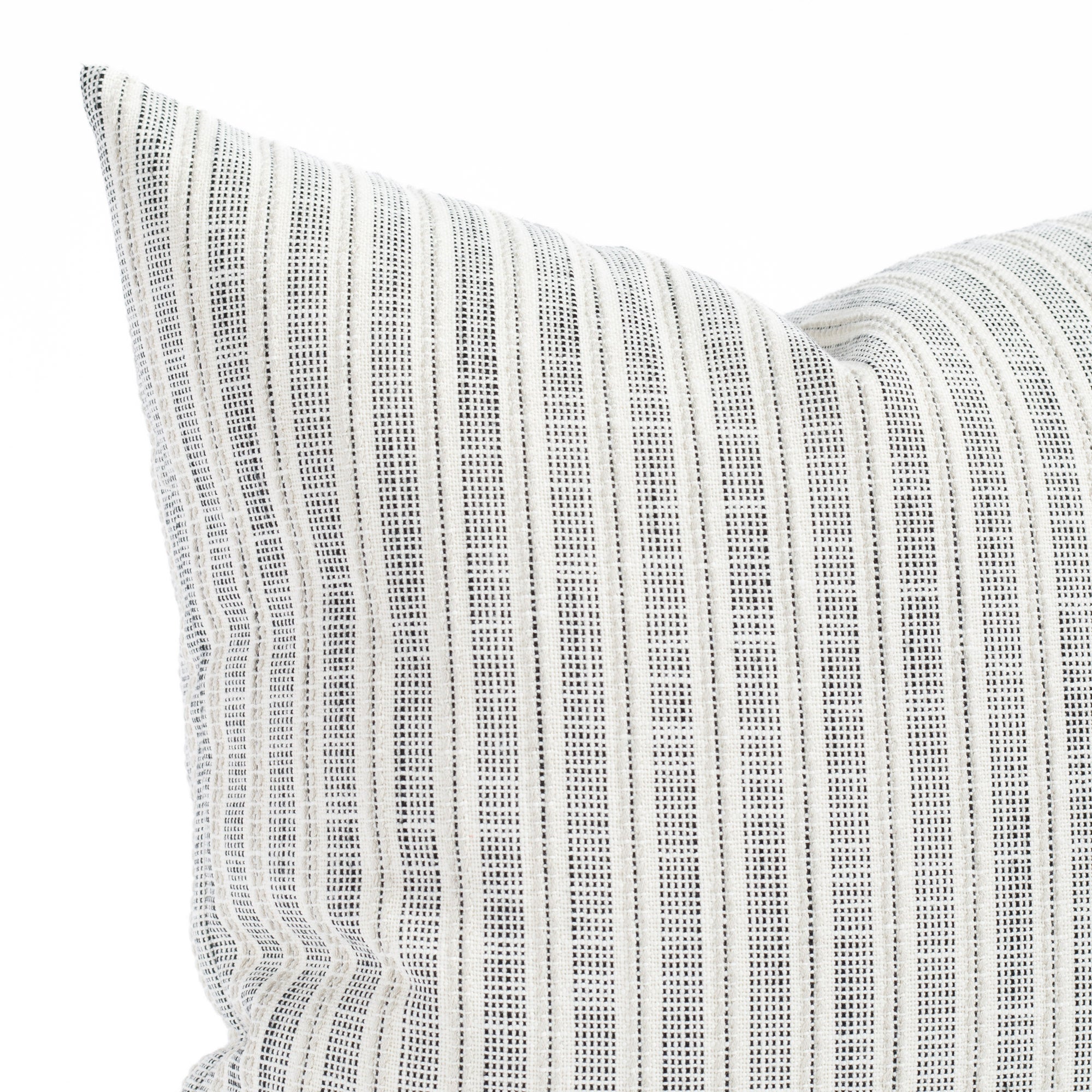 a cream and black stripe outdoor pillow : close up view