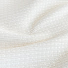 Arlo Fabric Salt, a white basket weave textured stain resistant upholstery fabric from Tonic Living