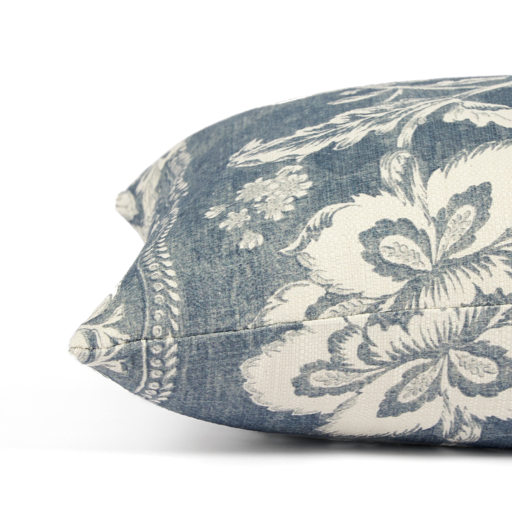 Side view of Tonic Living Ashford extra large lumbar pillow highlighting its blue and white botanical vine design.