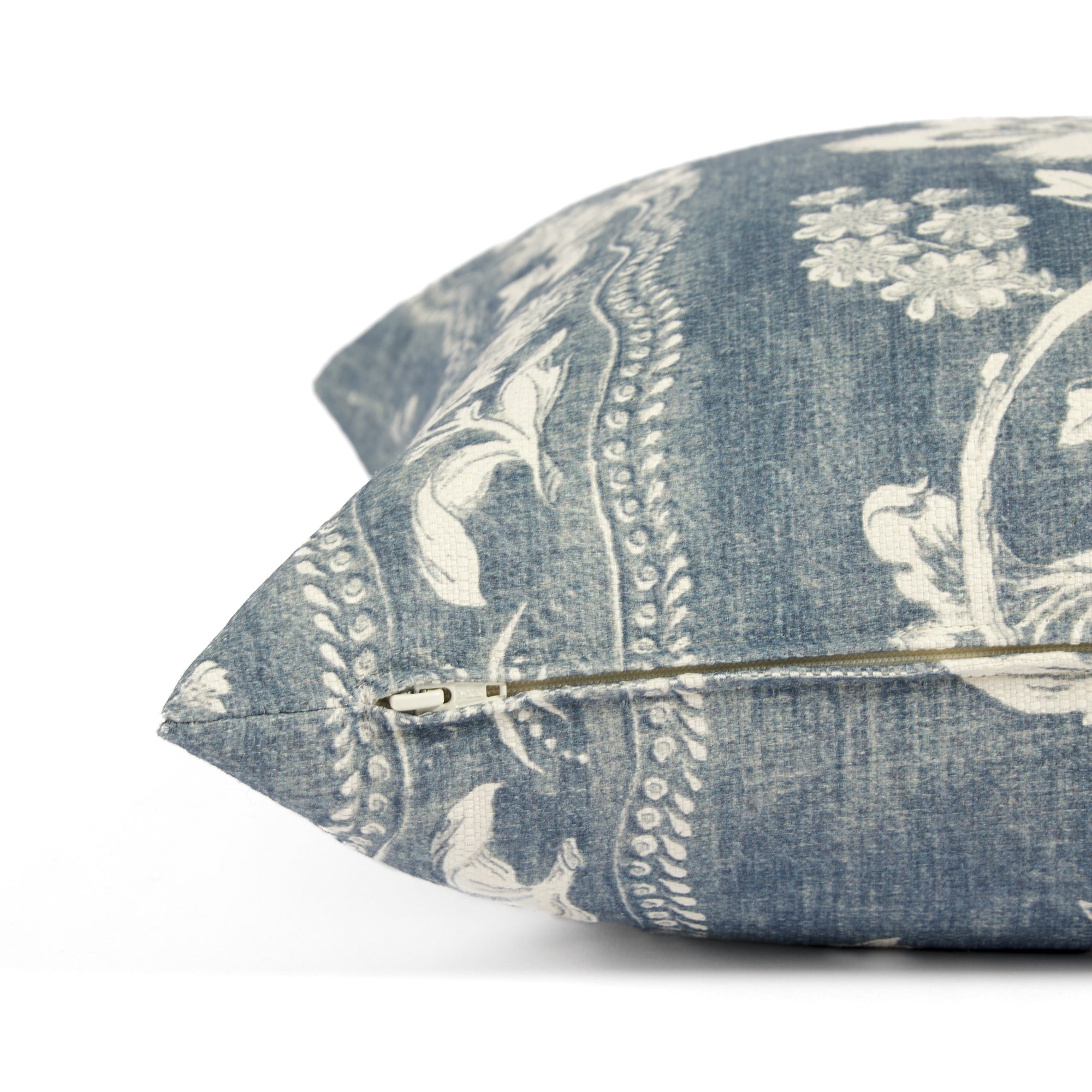 Side zipper detail of Tonic Living Ashford 20x20 throw pillow in chambray blue floral print.