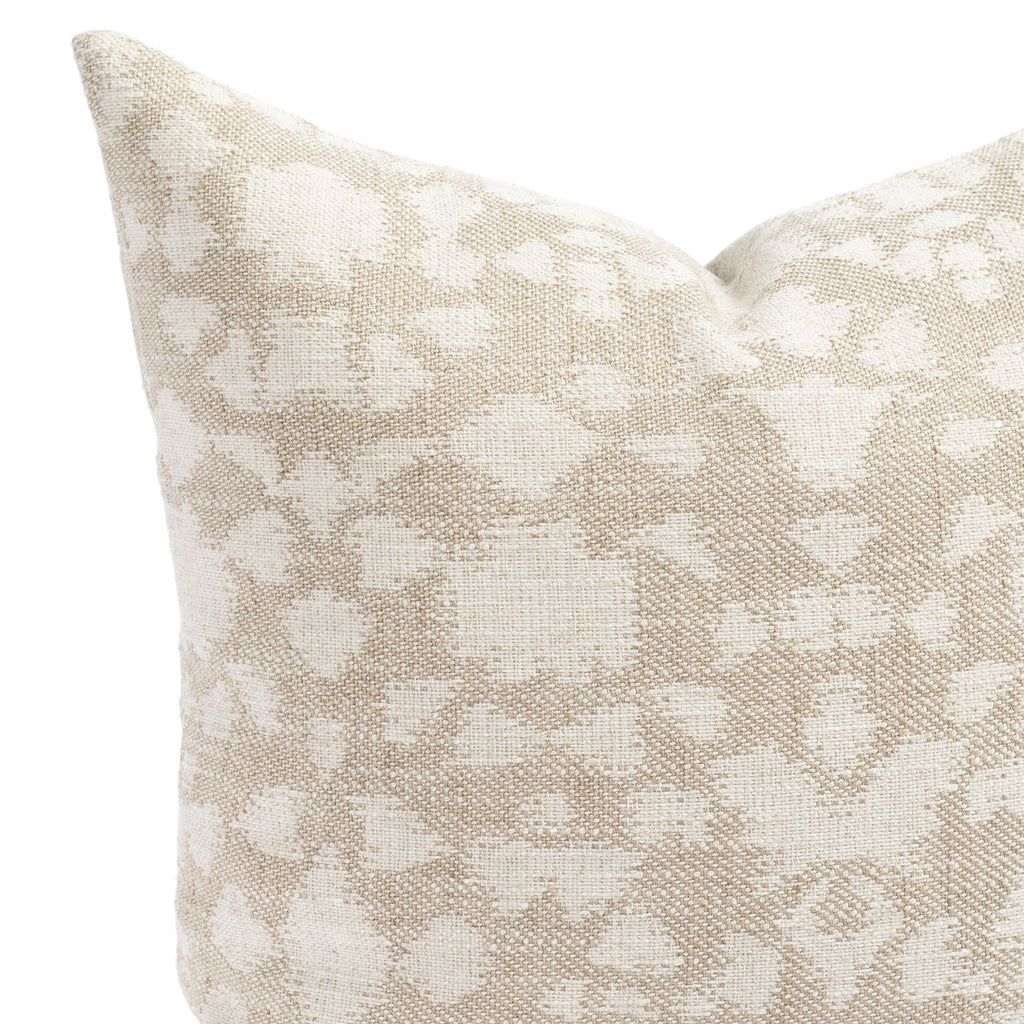 a greige and cream abstract floral print throw pillow: close up view