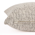 Side view of Atlas 22x22 pillow with hidden zipper, off-white and black indoor-outdoor cushion by Tonic Living.