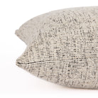 Detailed side view of Atlas 22x22 indoor-outdoor pillow, off-white and black textured stripe fabric, Tonic Living.