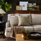 Living room with Cyprus Moss green and Atlas Salt & Pepper black and white pillows styled on a sofa – Tonic Living