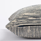 a indigo blue and grey patterned lumbar pillow : side zipper detail