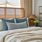 Tonic Living Bedford Denim decorative pillows with Lane Chambray XL lumbar cushion, styled on a bed