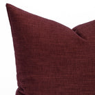 Close up of Bedford 22x22 decorative cushion in deep merlot red showcasing soft chenille texture.