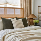 Tonic Living Bedford earthy green decorative pillows styled with Rexton Stripe moss cushion on a layered bed scene
