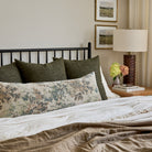 Tonic Living Bedford moss green toss pillows styled on bed with Manor Tapestry bolster cushion for elegant layered look