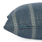 Side zipper detail of Brunswick Stripe Chambray lumbar pillow by Tonic Living — blue and white vertical stripe design with soft, textured finish.