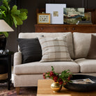Couch styled with Buckley Wheat 22x22 pillow and Dunrobin Stripe Sable 22x22 pillow – Tonic Living
