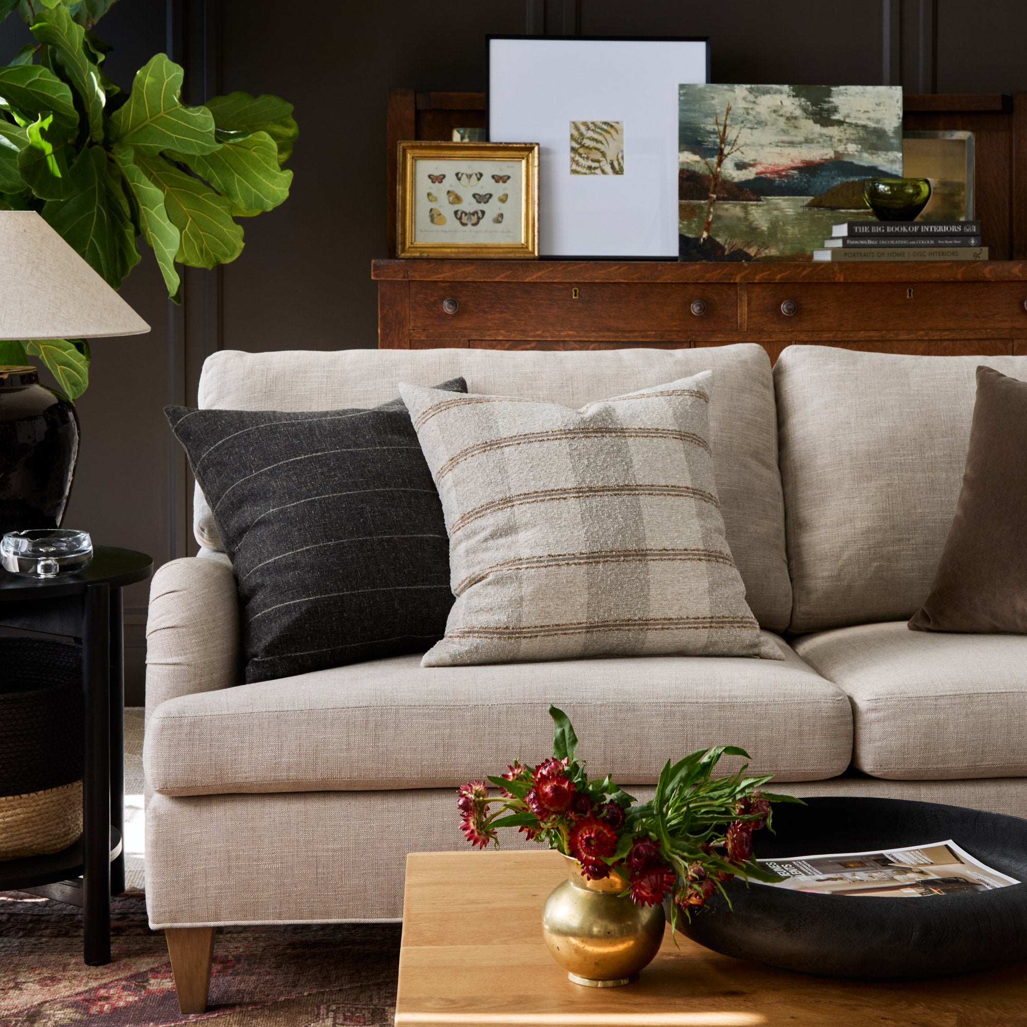 Couch styled with Buckley Wheat 22x22 pillow and Dunrobin Stripe Sable 22x22 pillow – Tonic Living