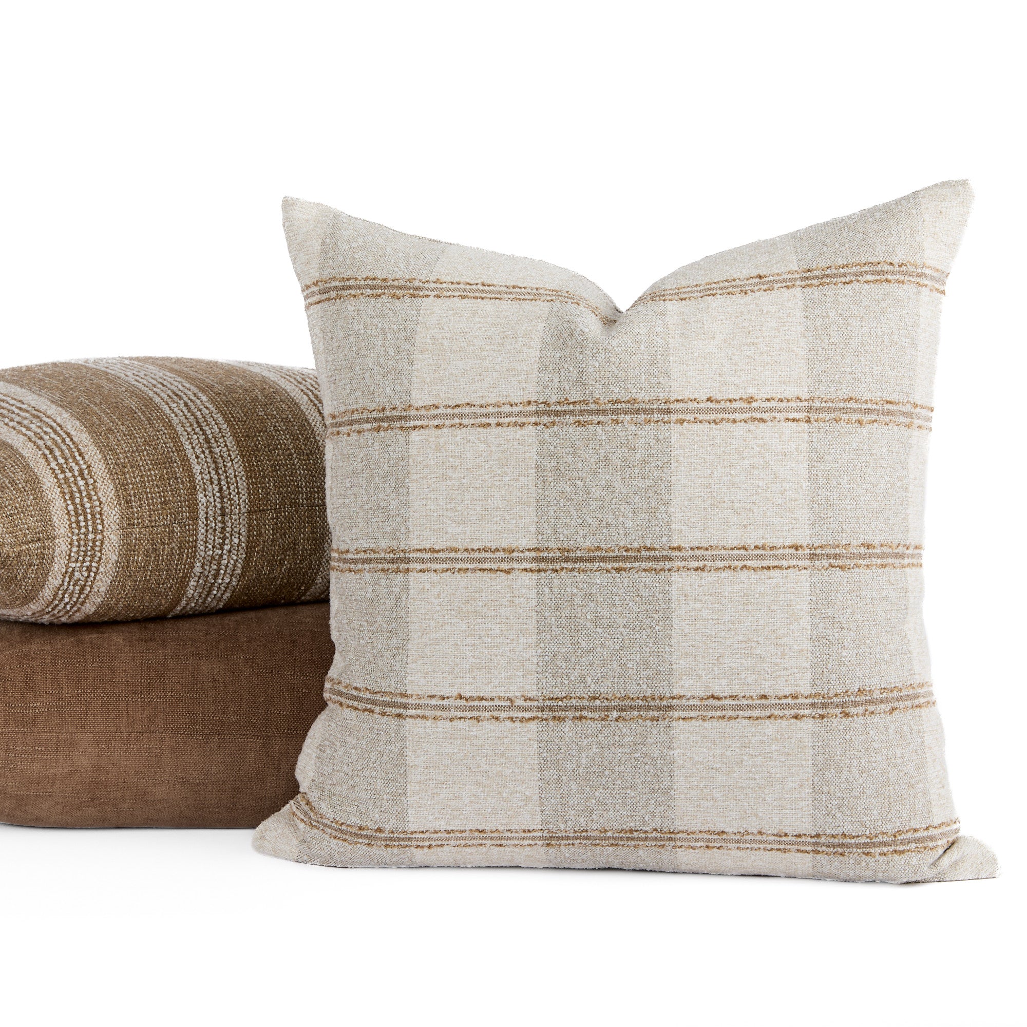 Buckley Wheat pillow with Acadia Stripe Cinnamon and Blaine Cinnamon pillows on white backdrop – Tonic Living