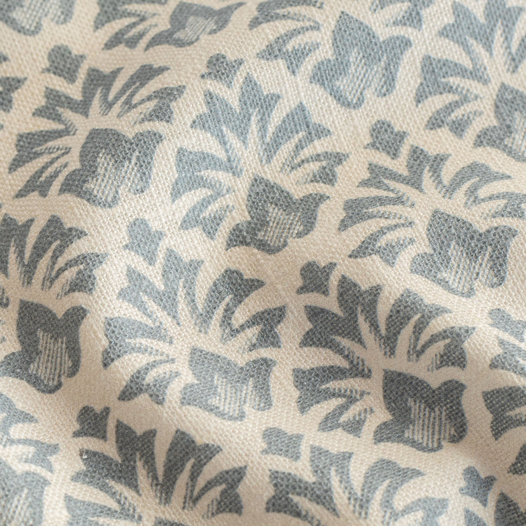 a blue and cream floral block print fabric