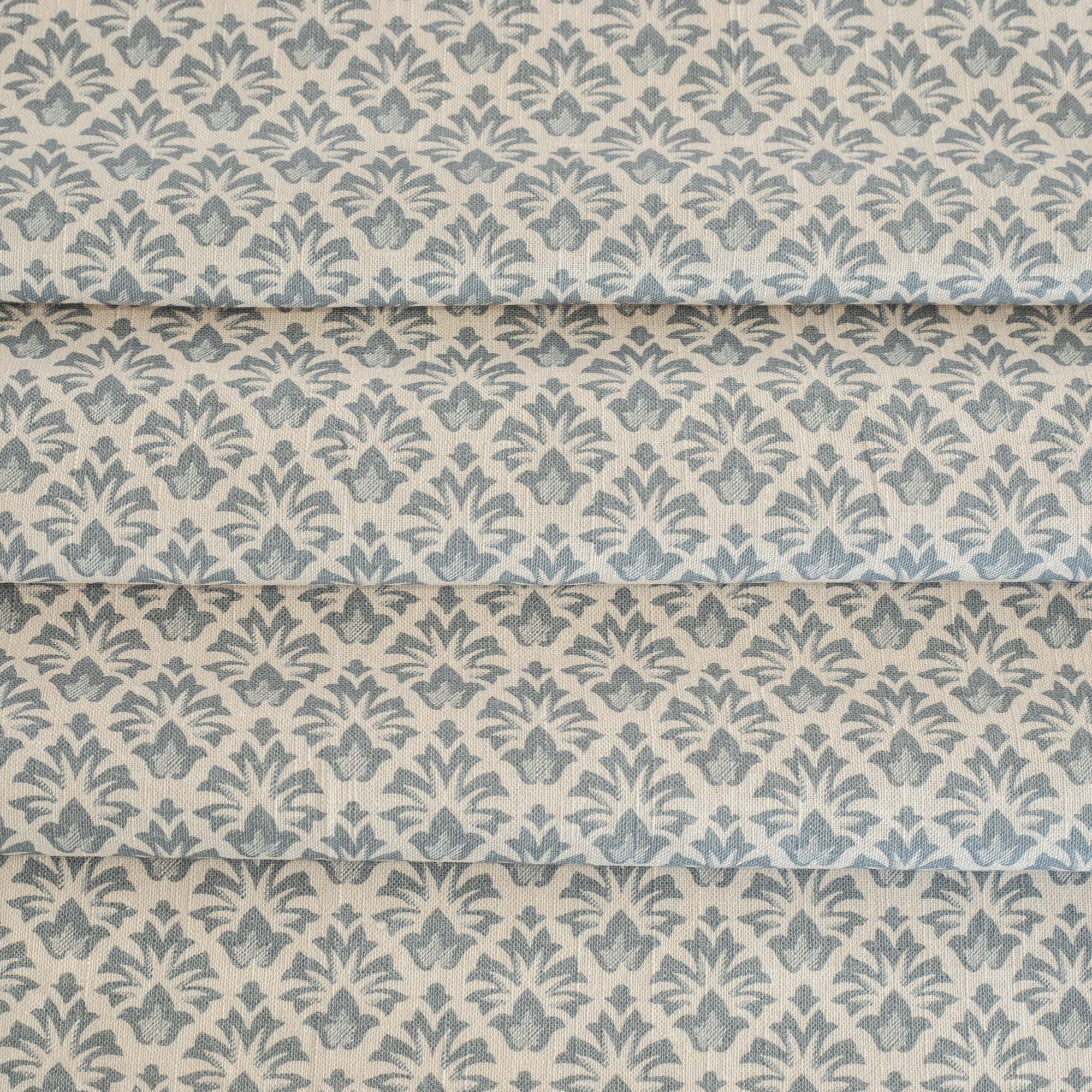 an earthy blue and sandy cream floral block print home decor fabric