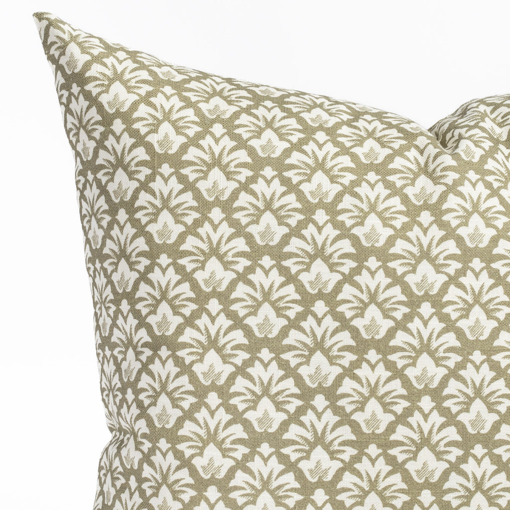 an olive green and cream floral block print throw pillow : close up detail view