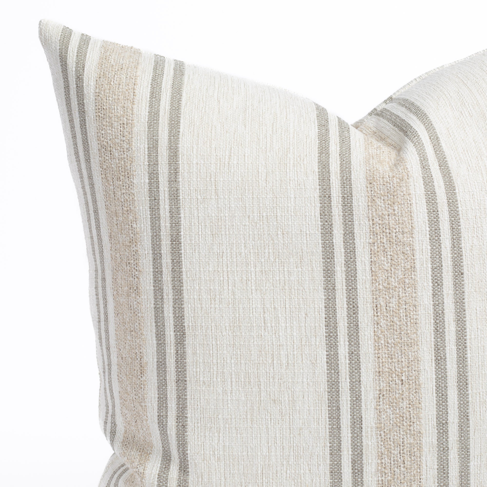 a white, cream and taupe indoor outdoor striped pillow : close up view